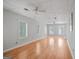 Large, versatile bonus room with hardwood flooring, multiple windows, and a drop ceiling at 4226 Highway 155 N, Stockbridge, GA 30281