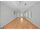 Spacious bonus room with hardwood floors, white walls, drop ceiling, and ample natural light at 4226 Highway 155 N, Stockbridge, GA 30281