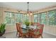 Eat-in dining area is surrounded by windows with green views at 4226 Highway 155 N, Stockbridge, GA 30281
