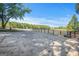 Long paved driveway leads to a picturesque property with trees and expansive greenery at 4226 Highway 155 N, Stockbridge, GA 30281
