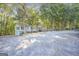 Home's front exterior featuring a wooden wheelchair ramp surrounded by mature trees at 4226 Highway 155 N, Stockbridge, GA 30281