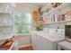 Laundry room with shelving, window, washer, and dryer at 4226 Highway 155 N, Stockbridge, GA 30281