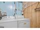 Functional laundry area with washer, dryer, and shelving for storage at 4226 Highway 155 N, Stockbridge, GA 30281