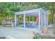 Inviting outdoor pergola featuring a dining set and bar area, ideal for gatherings and enjoying the beautiful surroundings at 4226 Highway 155 N, Stockbridge, GA 30281
