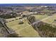 Aerial view of the 11.86-acre property, with a long driveway and ample green space at 271 Trestle Rd, Locust Grove, GA 30248