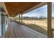 Expansive covered back porch with ceiling fans offers tranquil views of the yard at 271 Trestle Rd, Locust Grove, GA 30248