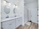 Bathroom boasts dual sinks, granite countertop, and ample lighting at 271 Trestle Rd, Locust Grove, GA 30248