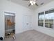 Bright bedroom offers great natural light, white walls and carpeted floors at 271 Trestle Rd, Locust Grove, GA 30248