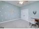 Comfortable bedroom with blue walls, a ceiling fan, and a work desk at 271 Trestle Rd, Locust Grove, GA 30248