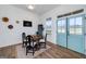 Cozy dining room with rustic accents, a wooden table, and stylish seating, adjacent to bright blue doors at 271 Trestle Rd, Locust Grove, GA 30248