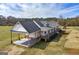 Exterior of the home boasts a covered carport, sprawling yard, and a play area at 271 Trestle Rd, Locust Grove, GA 30248