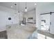Granite countertop island with pendant lighting and stainless steel appliances in this modern kitchen at 271 Trestle Rd, Locust Grove, GA 30248