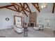Inviting living room with a vaulted ceiling, brick fireplace, built-in shelving, and lots of comfortable seating at 271 Trestle Rd, Locust Grove, GA 30248