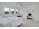 Spacious main bedroom featuring a ceiling fan, plush carpeting, and lots of natural light at 271 Trestle Rd, Locust Grove, GA 30248