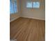 Bedroom with hardwood floors and natural light streaming through windows at 2577 Headland Dr, East Point, GA 30344