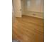 Bedroom has hardwood flooring, light-filled windows, and a closet at 2577 Headland Dr, East Point, GA 30344