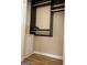 Walk-in closet with custom storage shelving and hardwood floors at 2577 Headland Dr, East Point, GA 30344