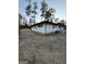 Exterior view of home with big trees and a spacious backyard at 2577 Headland Dr, East Point, GA 30344