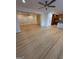Living room has hardwood flooring that extends to the kitchen, recessed lighting, and shuttered windows at 2577 Headland Dr, East Point, GA 30344