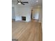 Bright living room featuring hardwood floors and a traditional brick fireplace at 2577 Headland Dr, East Point, GA 30344
