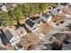 Aerial view of the residential neighborhood showcasing rooftops, driveways, and mature trees surrounding the homes at 2391 Wellborn Hills Ct, Lithonia, GA 30058