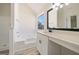Bright bathroom featuring a tub, vanity with solid surface counters, and modern fixtures at 2391 Wellborn Hills Ct, Lithonia, GA 30058