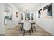 Contemporary dining room with modern chandelier, large windows, and stylish decor at 2391 Wellborn Hills Ct, Lithonia, GA 30058