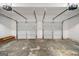 Spacious two-car garage with concrete floor and two garage door openers at 2391 Wellborn Hills Ct, Lithonia, GA 30058
