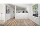Open hallway with neutral walls and wood-look flooring at 2391 Wellborn Hills Ct, Lithonia, GA 30058