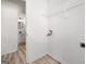 Convenient laundry hookups and wire shelving, adjacent to the bathroom at 2391 Wellborn Hills Ct, Lithonia, GA 30058