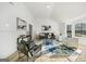 Open-concept living room featuring wood floors, high ceilings, and a stylish decor with ample natural light at 2391 Wellborn Hills Ct, Lithonia, GA 30058