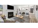Spacious living room with a fireplace and stylish decor, leading into an open kitchen at 2391 Wellborn Hills Ct, Lithonia, GA 30058