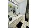 Bright bathroom featuring a large mirror, a shower, and ample counter space at 206 Wildflower Ct, Mcdonough, GA 30252