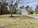 Single-Gathering home with a large front yard and a two-car garage at 206 Wildflower Ct, Mcdonough, GA 30252