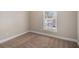 Bright bedroom features neutral walls, carpet flooring, and a window offering natural light at 3822 Holland Dr, Snellville, GA 30039