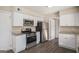Well-appointed kitchen featuring stainless steel appliances, granite countertops, and ample cabinet space at 3822 Holland Dr, Snellville, GA 30039