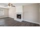 Inviting living room featuring a cozy fireplace, hardwood floors, and bright natural light at 3822 Holland Dr, Snellville, GA 30039