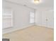 Bright bedroom with carpet, double windows, and a double door closet at 6275 Glen Oaks Ln, Atlanta, GA 30328