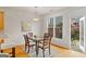 Bright dining area featuring hardwood floors and access to an outdoor patio at 6275 Glen Oaks Ln, Atlanta, GA 30328