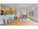 Eat-in kitchen with light wood cabinets, breakfast bar, and dining area at 6275 Glen Oaks Ln, Atlanta, GA 30328