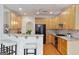 Open kitchen featuring a breakfast bar, ample wood cabinets, and modern appliances at 6275 Glen Oaks Ln, Atlanta, GA 30328