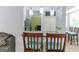 Open kitchen view with a bar, pendant lights, and comfortable seating at 1408 Fairfield Sw Dr, Lilburn, GA 30047