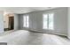 Open living room with ample natural light and modern architectural details at 1408 Fairfield Sw Dr, Lilburn, GA 30047