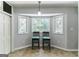 Bright breakfast nook featuring a bay window with seating for two at 1408 Fairfield Sw Dr, Lilburn, GA 30047