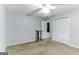 Spacious bedroom featuring a ceiling fan, ample closet space, and neutral decor at 1408 Fairfield Sw Dr, Lilburn, GA 30047