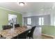 Inviting dining room featuring a marble-topped table and contemporary chairs at 1408 Fairfield Sw Dr, Lilburn, GA 30047