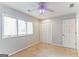 Bedroom with window, ceiling fan and closet at 1408 Fairfield Sw Dr, Lilburn, GA 30047