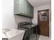 Laundry room with newer appliances, sink and overhead storage at 1408 Fairfield Sw Dr, Lilburn, GA 30047