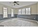 Finished bonus room with tile flooring, wainscotting and three bright windows at 618 Grecken Green, Peachtree City, GA 30269