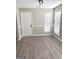 Dining room featuring new floors and two large windows providing natural light at 3824 Charlotte Dr, Rex, GA 30273